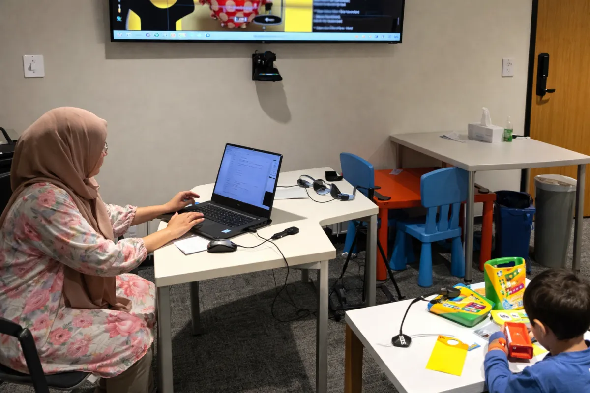 A child interacting with AI
